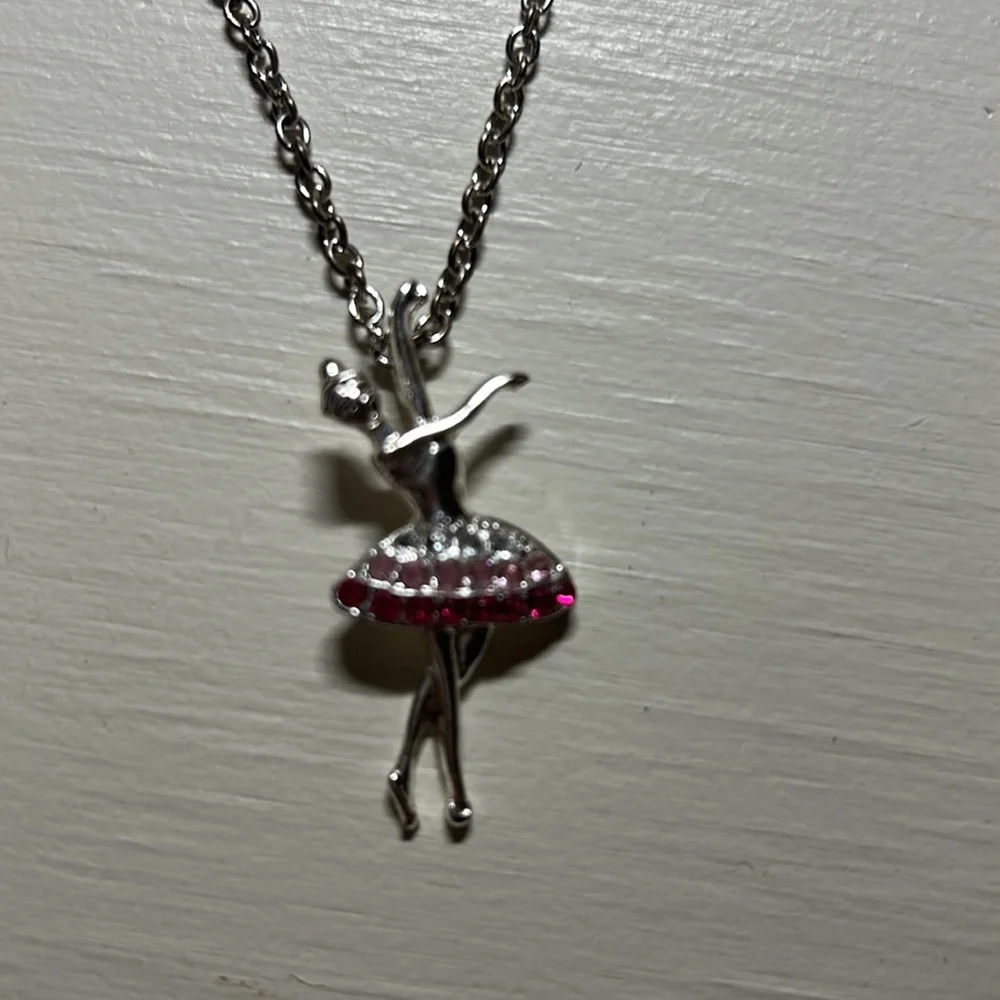 Kids 16” silver necklace with a 1.5” ballerina pendant. Gently used.